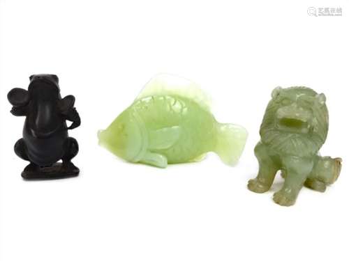 A CHINESE GREEN HARDSTONE MODEL OF A LION, A FISH AND A FROG