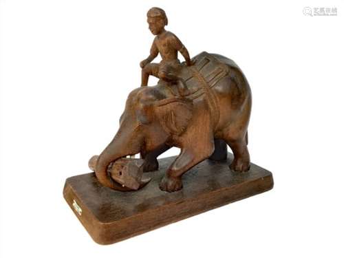 A BURMESE CARVED TEAK MODEL OF AN ELEPHANT AND RIDER