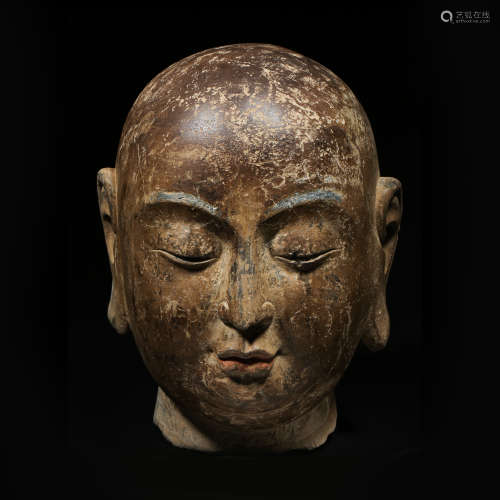 A CARVED ANCIENT CHINESE STONE BUDDHA HEAD