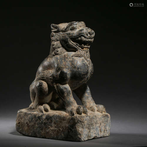 A CARVED ANCIENT CHINESE STONE LION