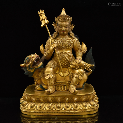 RIDING LION VAISHRAVANA GILT BRONZE …