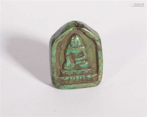 A Carved Turquoise Pendant