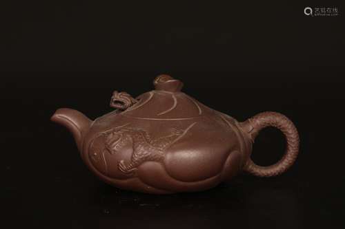 Dark-red enameled pottery teapot