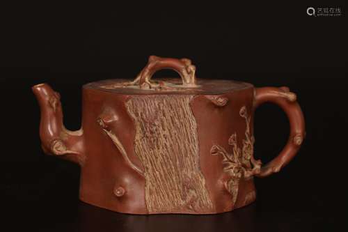 Dark-red enameled pottery teapot