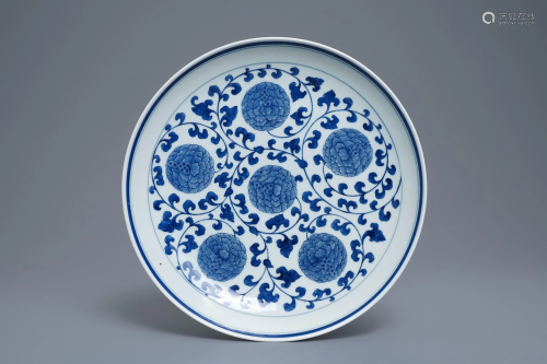 A Chinese blue and white 'peony scroll' dish, mar…