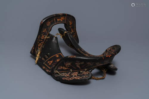 A Japanese painted and lacquered wooden saddle,