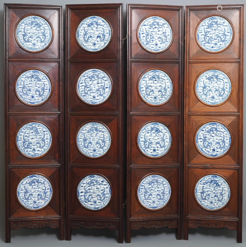 A Chinese wooden room divider with blue and …