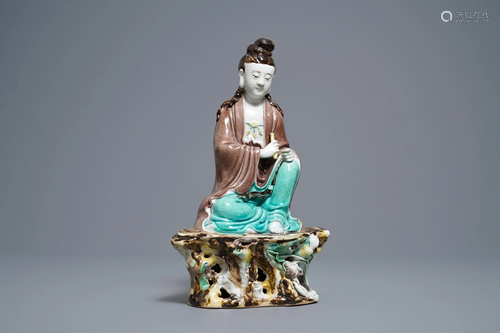 A Chinese verte biscuit figure of Buddha seated on a