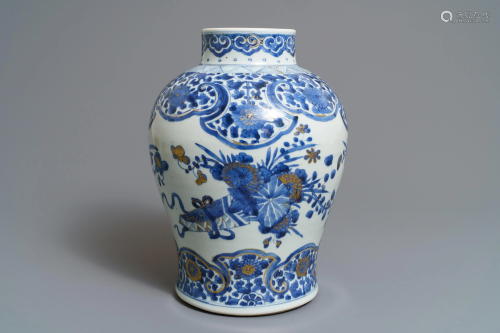 A Chinese gilt-decorated blue and white vase with