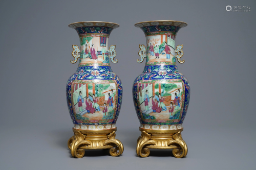 A pair of Chinese Canton famille rose vases wit…
