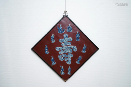 A Chinese red-lacquered plaque with blue a…