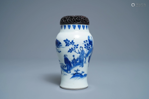 A Chinese blue and white vase with figures in a