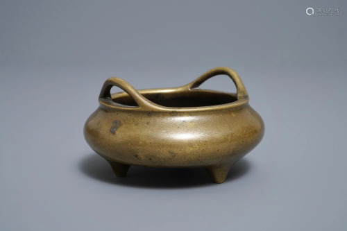 A Chinese bronze tripod incense burner, Xuande mark,