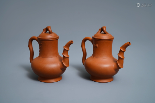 A pair of Chinese Yixing stoneware ewers with applied