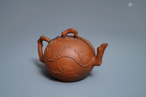 A large Chinese Yixing stoneware teapot with applied