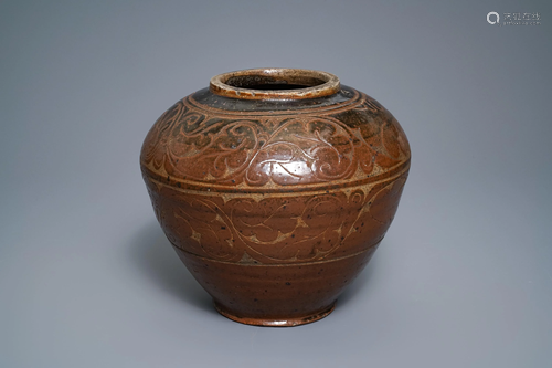 A Chinese brown-glazed cizhou jar with incised design,