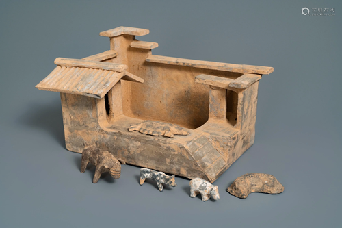 A Chinese earthenware model of a stable and five