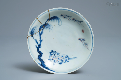 A Chinese blue, white and underglaze red plate wit…