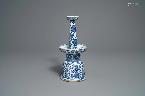 A large Chinese blue and white candleholder with…