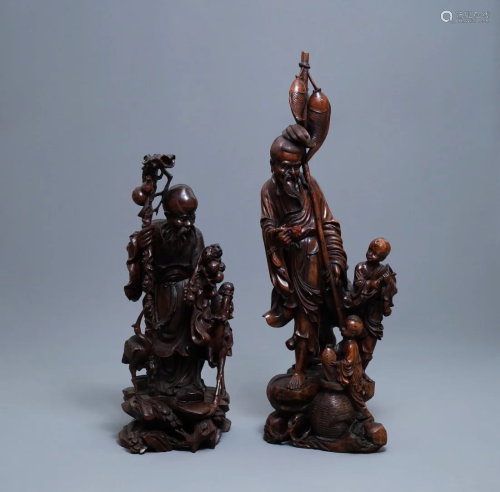 Two large Chinese carved wood figures of imm…