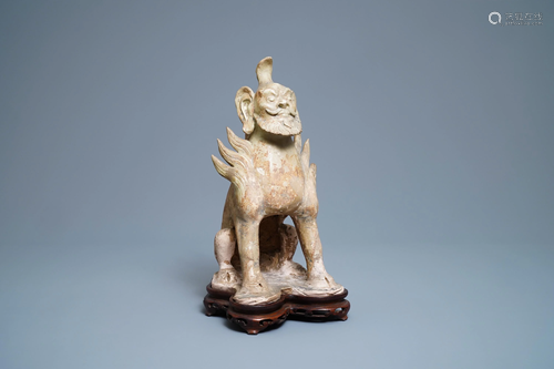 A Chinese straw-glazed stoneware 'earth spirit', Sui