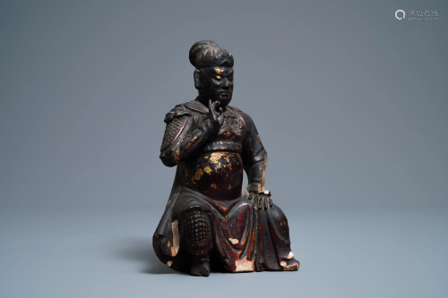 A Chinese gilt-lacquered wood figure of Guan Yu, Ming