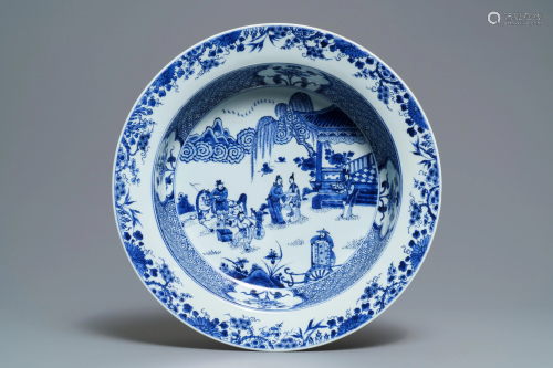 A deep Chinese blue and white dish with figures i…