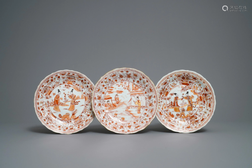 Three Chinese iron red and gilt lotus-moulded plates,