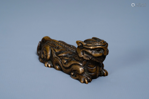 A Chinese bronze 'mythical beast' scroll weight,…