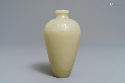 A Chinese light celadon jade relief-decorated meiping