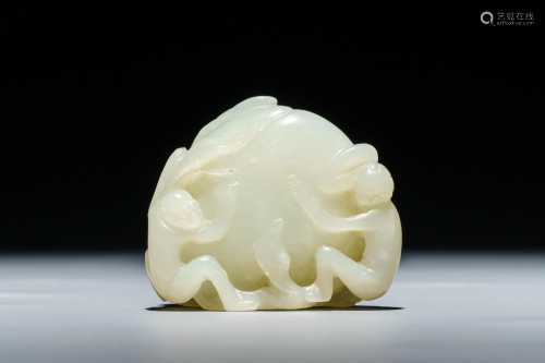A Chinese celadon jade carving of two monkeys on a