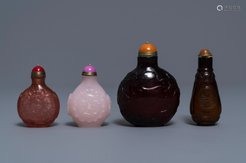 Four Chinese cherry red and pink glass snuff bottles,
