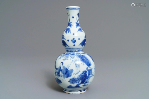 A Chinese blue and white double gourd vase wit…