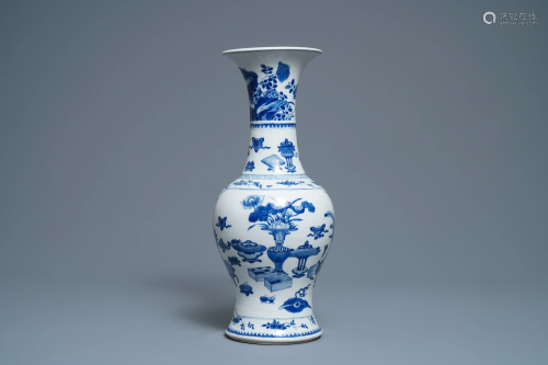A Chinese blue and white vase with precious obj…