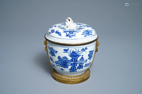 A Chinese blue and white bowl and cover with gilt
