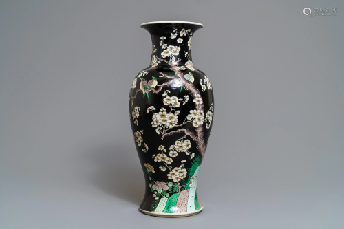 A Chinese famille noire 'magpie and prunus' vase,