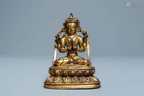 A Sino-Tibetan inlaid gilt bronze figure of Buddha,