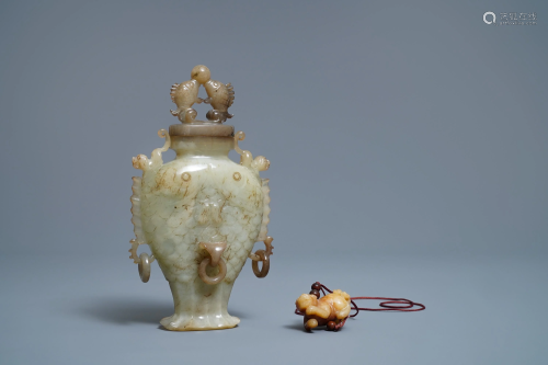 A Chinese jade 'twin fish' vase and a russet jade …
