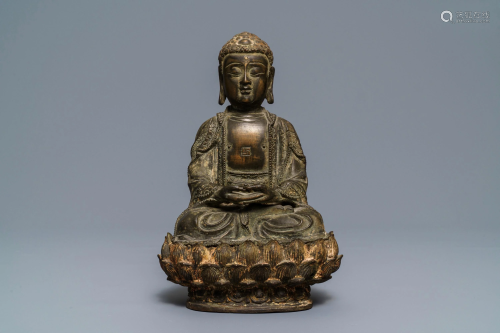 A Chinese bronze figure of Buddha on a lotus throne,