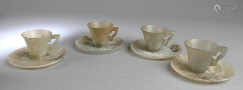 A Set of Four Antique Jadestone Teacups with Saucers