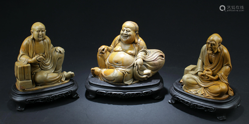 A Group of Three Soapstone Carved Statues