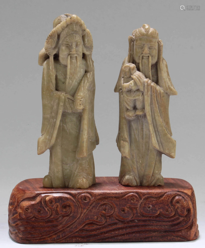 A Pair of Carved Figurines