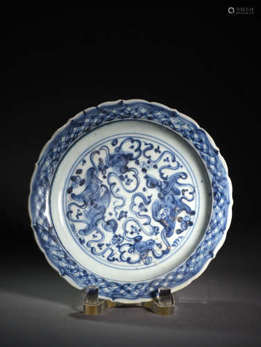 A BLUE  AND  WHITE PLATE  WITH  LOINS  PLAYING  BALL IN  BLANKING PERIOD