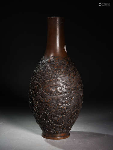 A COPPER BOTTLE CARVED  WITH  CLOUD  AND  DRAGON  PATTERNS IN  QING  QIANLONG