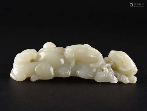 A WHITE JADE RAMS GROUP BRUSH REST, QING DYNASTY