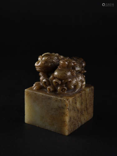 A CELADON AND RUSSET MYTHICAL BEAST SEAL, QING DYNASTY