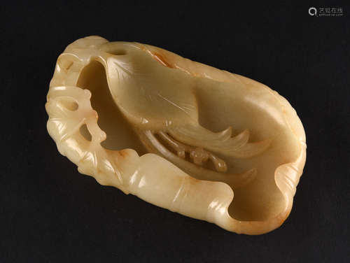 A CREAMY WHITE AND RUSSET JADE WASHER, QING