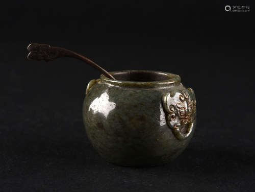 A SPINACH-AND-GREEN RUSSET JADE WATER CONTAINER, MING DYNASTY