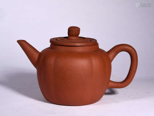 A YIXING GLAZED LOBED TEAPOT, 17TH CENTURY