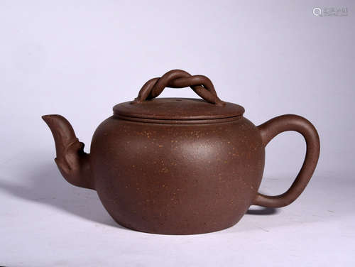 A MARKED YIXING GLAZED TEAPOT, MING DYNASTY